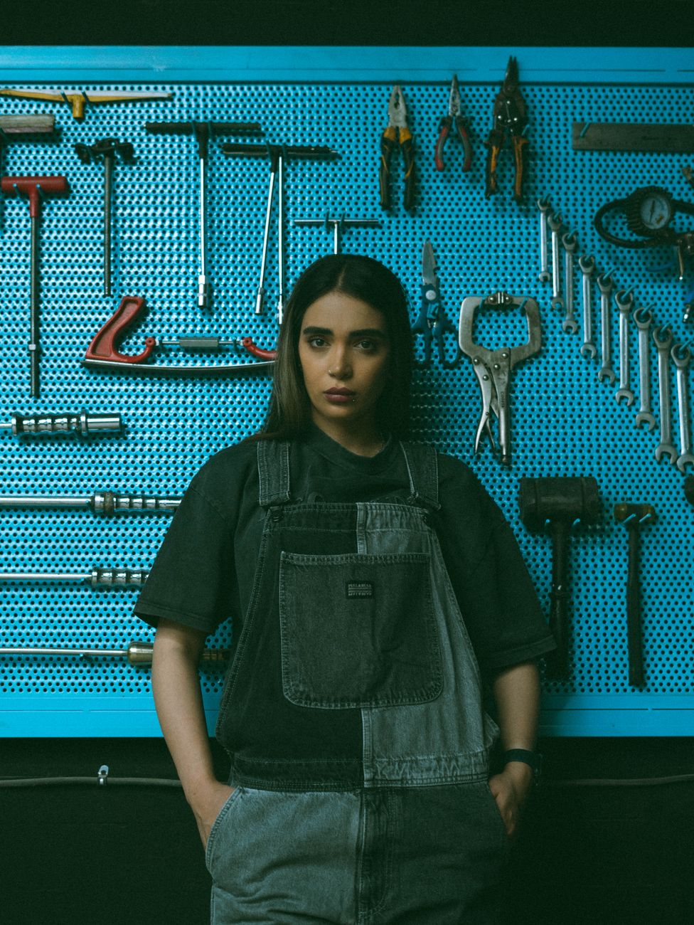 female mechanic in workshop with tools